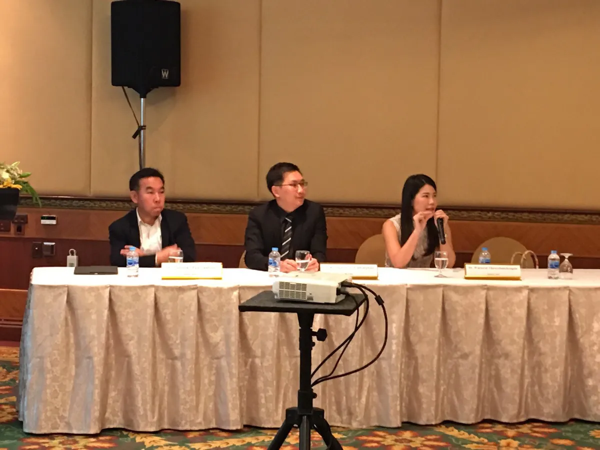 Dr. Waleerat speaking into a microphone during the 2017 LDK workshop panel in Bangkok