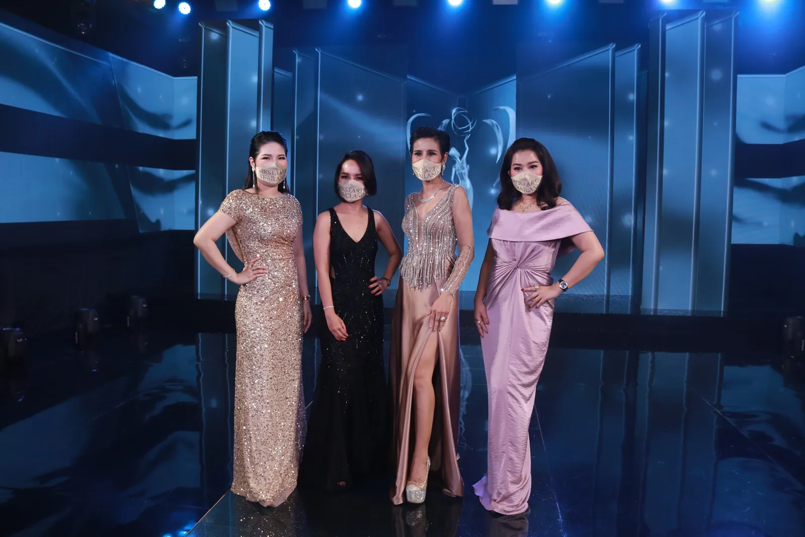 Dr. Waleerat with the Crown Directors on the Miss Earth Thailand 2021 stage